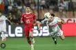 صورة تجمع شعارات أندية الأهلي والزمالك وليفربول ومانشستر سيتي مع خلفية لملاعب كرة القدم